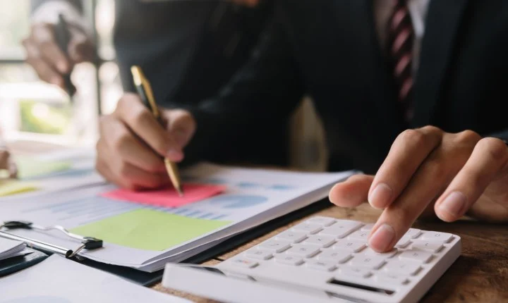 Advisers reviewing management accounts in a meeting
