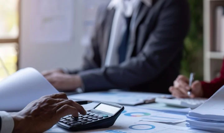 Auditor annotating financial statements